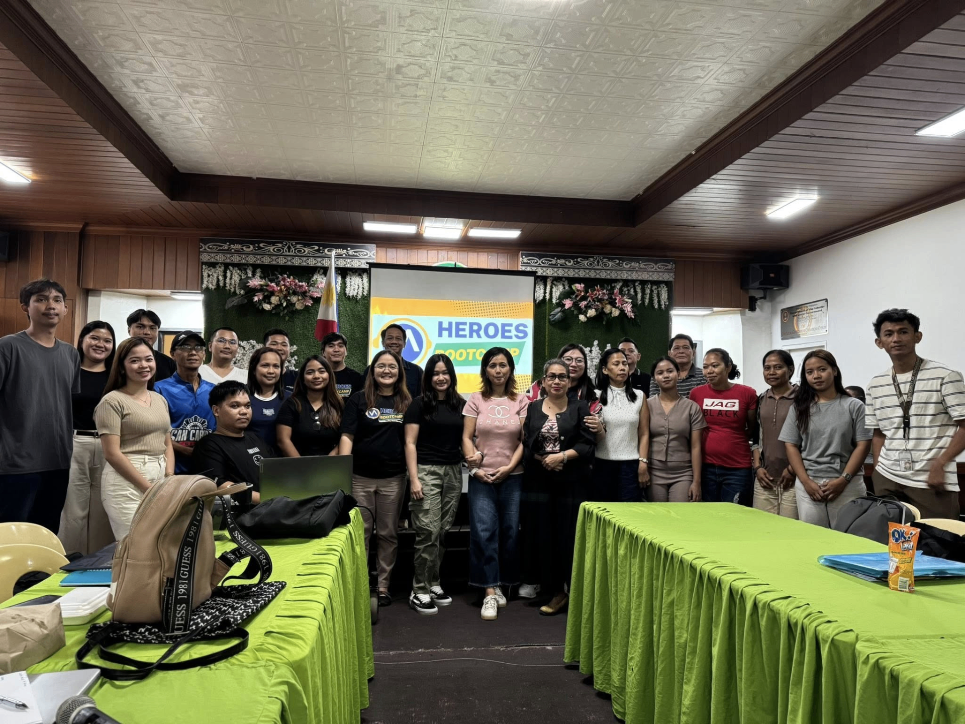 Group photo of VA Heroes Bootcamp graduates with the Philippine flag